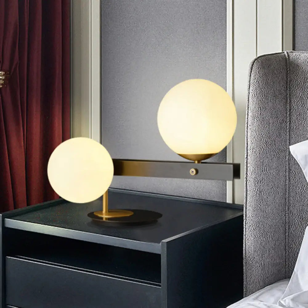 metal table lamps with a matte black finish for a sleek appearancemetal table lamps with a matte black finish for a sleek appearanceModern Opal Glass Sphere Table Light with Black Metal Base - 2 Bulbs, Small Desk Lamp